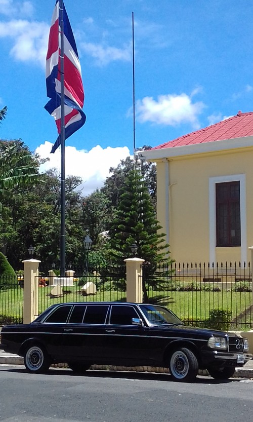 COSTA-RICA-FLAG-WITH-A-MERCEDES-300D-LANG-LIMO.jpg